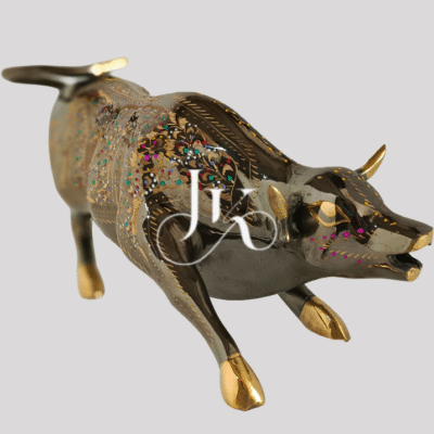 Brass bull 14-inch sculpture featuring vibrant floral engravings and polished golden horns